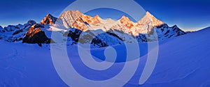 View of snow covered landscape with Dent Blanche mountains and Weisshorn mountain in the Swiss Alps near Zermatt. Panorama