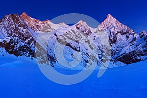 View of snow covered landscape with Dent Blanche mountains and Weisshorn mountain in the Swiss Alps near Zermatt. Panorama