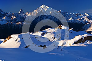 View of snow covered landscape with Weisshorn mountain in the Swiss Alps near Zermatt. Panorama of the Weisshorn and surrounding photo