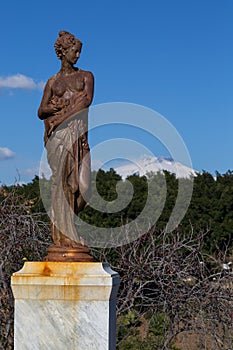 View of snow covered Mount Etna from Giardino Bellini in Catania, Sicily photo