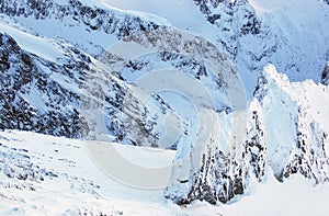 View of snow-covered mountains in the High Tatra from Lomnicky P