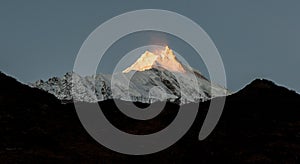 View of snow covered peak of Mount Manaslu during sunrise 8 156 meters with clouds in Himalayas, sunny day at Manaslu Glacier