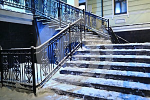 View of snow covered stairs of building