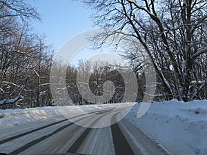 View of the snow-covered track from the windshield of the car