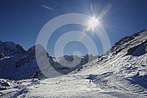 View of snow mountains and ski slope in Switzerland Europe on a cold sunny day