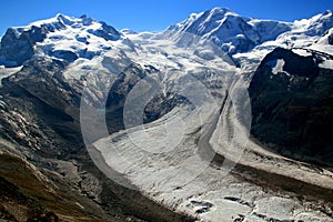 View of the snow-white Matterhorn glacier with a small lake from Mount Gornergrat in Switzerland