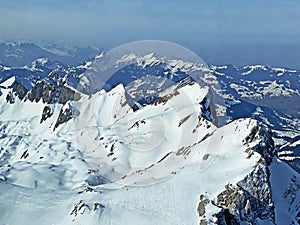 View of the snowy alpine peaks from SÃ¤ntis, the highest peak of the Alpstein mountain range in the Swiss Alps