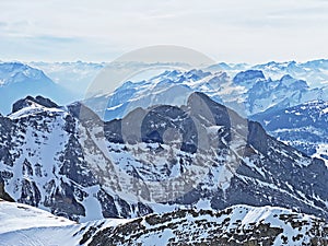 View of the snowy alpine peaks from SÃ¤ntis, the highest peak of the Alpstein mountain range in the Swiss Alps