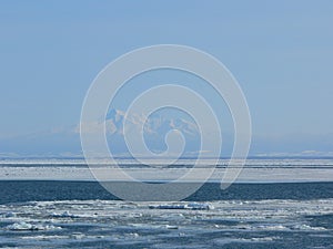 View of a snowy capped mountain in winter from afar