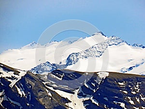 View of the snowy peaks and glaciers of the Swiss Alps from the Pilatus mountain range in the Emmental Alps, Alpnach - Switzerland