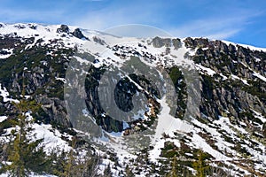 View of the snowy peaks of the mountain on a sunny day.