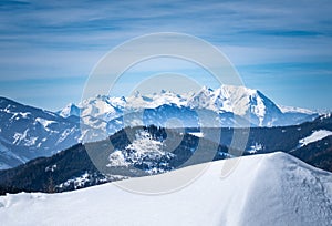 View from snowy plateau Kaiserau to mountain Dachstein on winterday