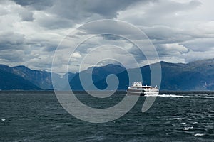 View of Sognefjord with the boat sailing away photo