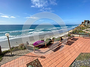 A view of Solana Beach from the top of the cliff with wood bench