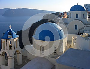 A view of some of the famous churches at Oia, Santorini, Greece photo