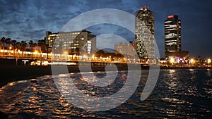 View of Somorrostro Beach in summer night Barcelona, Spain