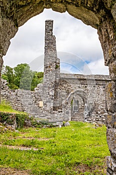 A view through a sone doorway of the abanoned ruins of Killone Abbey that was built in 1190 and sits on the banks of the Killone