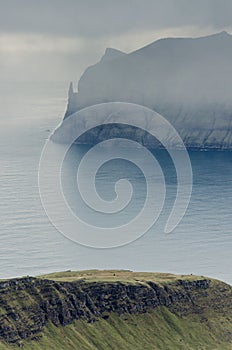 View from the Sornfelli mountain in Faroe Islands to the famous Trollkonufingur, witchs finger on Vagar island