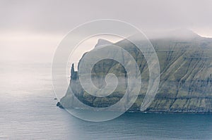 View from the Sornfelli mountain in Faroe Islands to the famous Trollkonufingur, witchs finger on Vagar island