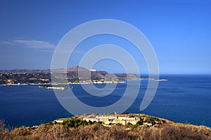 View of Souda Bay and the stone walls of the historic castle on the Greek island of Crete