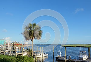 View of Southport NC riverfront with boat docks and seafood restaurants photo