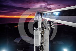 View of the SpaceX Falcon 9 rocket with a spaceship Crew Dragon on the launch pad, before launching into space. SpaceX