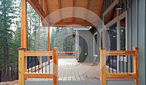 View of a spacious walkout deck with wooden railing