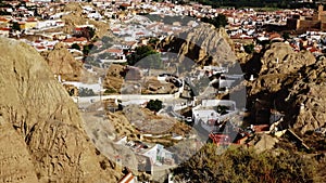 View of spanish city Guadix with famous troglodyte houses carved in tuff rocks