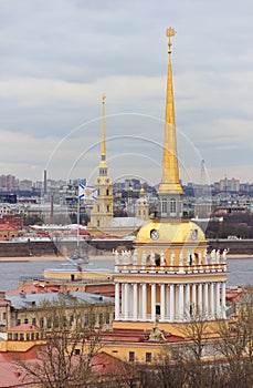 View of the spiers of the Admiralty and the Peter and Paul Fortress from the roof of St. Isaac`s Cathedral in St. Petersburg