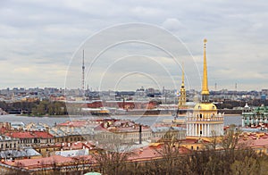 View of the spiers of the Admiralty and the Peter and Paul Fortress from the roof of St. Isaac`s Cathedral in St. Petersburg