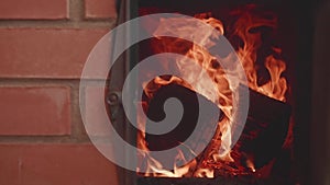 View of spirts of flame in furnace with door opened. Slow motion view