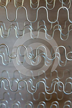 View of spring shock absorbers stretched on a frame inside a modern soft sofa