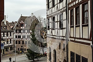 View of square Tiergaertnertorplatz with Pilatushaus building and Albrecht Duerer Haus, Nuremberg, Germany