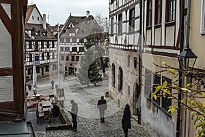 View of square Tiergaertnertorplatz with Pilatushaus building and Albrecht Duerer Haus, Nuremberg, Germany