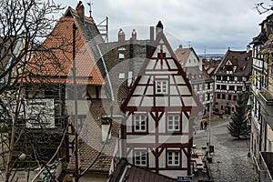 View of square Tiergaertnertorplatz with Pilatushaus building and restaurant Albrecht Duerer Haus, Nuremberg, Germany