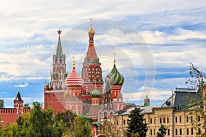 View of St. Basil`s Cathedral and Spasskaya tower of Kremlin on Red Square in Moscow, Russia