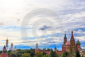 View of St. Basil`s Cathedral and Spasskaya tower of Kremlin on Red Square in Moscow, Russia