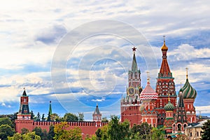 View of St. Basil`s Cathedral and Spasskaya tower of Kremlin on Red Square in Moscow, Russia