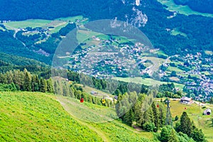 View of St.Gilgen and red Seilbahn cable car gondola from Zwolferhorn mountain