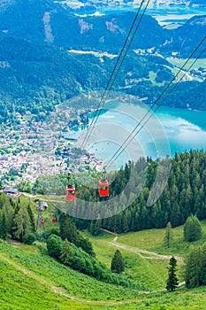 View of St.Gilgen and red Seilbahn cable car gondolas from Zwolferhorn mountain