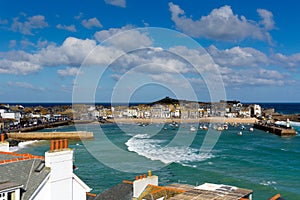 View of St Ives Cornwall England with harbour, boats and blue sky