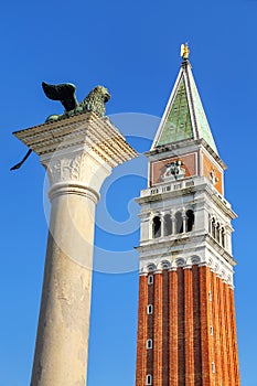 View of St Mark`s Campanile and Lion of Venice statue at Piazzet
