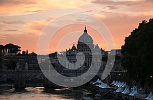 View of St. Peter`s Basilica and the Tiber River at sunset, Rome