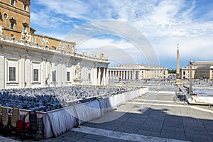 View of St. Peter`s Square with semicircular colonnade with statues Piazza Obliqua and St. Peter`s Basilica in Vatican City