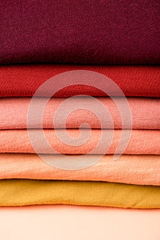 View of stack of folded colorful clothes