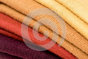 View of stack of folded colorful clothes