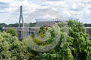 View of the stadium. Bridge over the Vistula river. City traffic. Urban landscape. Panorama view. Cloud sky. Warsaw