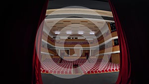 View from the stage theater with the red curtain opening