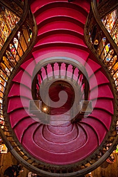 View on the stairs inside Lello Bookstore - famous book shop in Porto