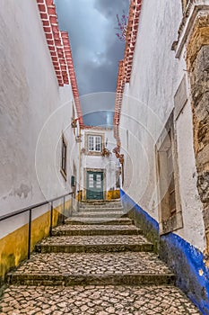 View of a stairs on street with Portuguese vernacular buildings on medieval village inside the fortress and Luso Roman castle of